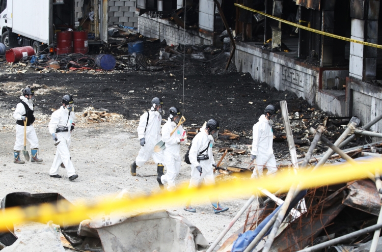 Police resume search at warehouse fire site