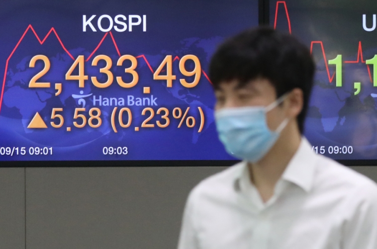 Seoul stocks open tad higher on brisk M&As, vaccine hopes
