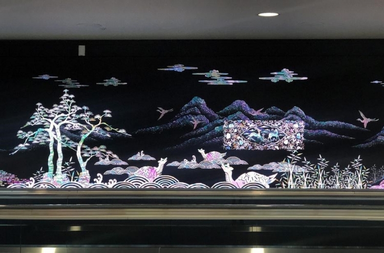 Media artwork with traditional Korean themes greet arrivals at Incheon Airport