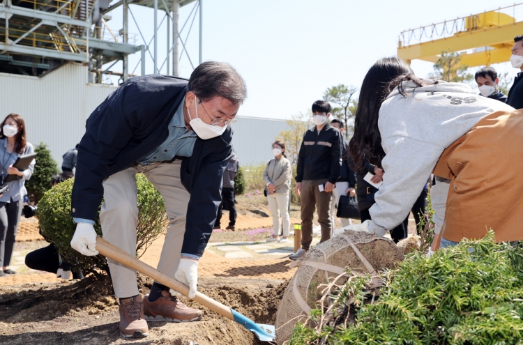 Moon attends tree-planting day event at historic power plant site