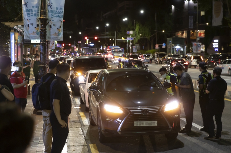 Hundreds of merchants hold late night drive-through rally against COVID-19 restrictions