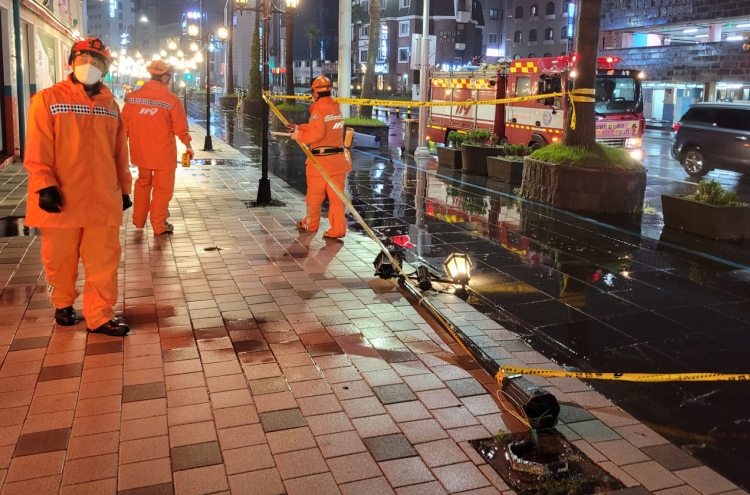 Typhoon Chanthu passes near Jeju, flooding roads, homes, canceling flights