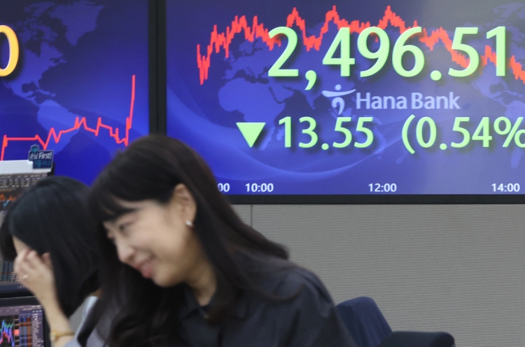 Seoul shares end lower amid US inflation data, default woes