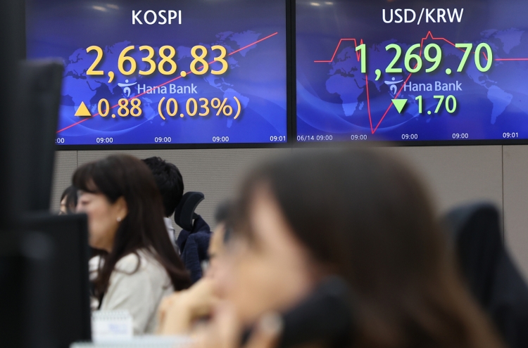 Seoul shares open tad lower ahead of Fed's rate decision