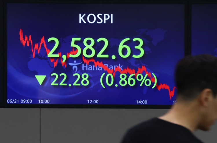 Seoul shares open almost flat as Powell signals more rate hikes