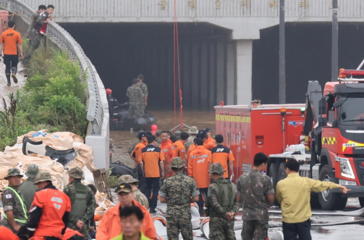 49 dead or missing in downpour after 4 more bodies recovered from tunnel