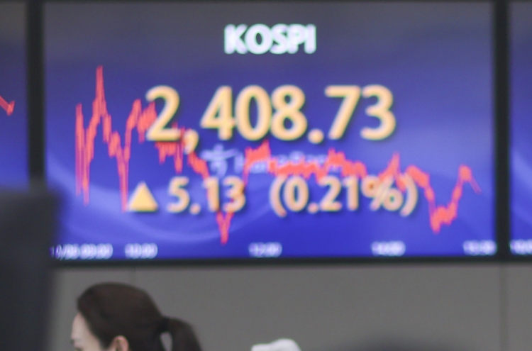 Seoul shares close tad higher ahead of key US jobs data