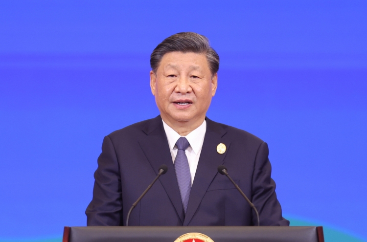 China's Xi promises more market openness and new investments