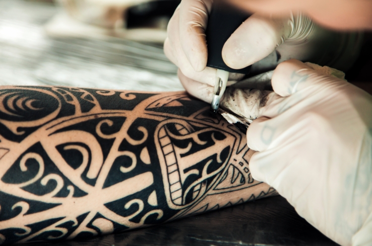 Government begins research on legalizing nonmedical tattooists