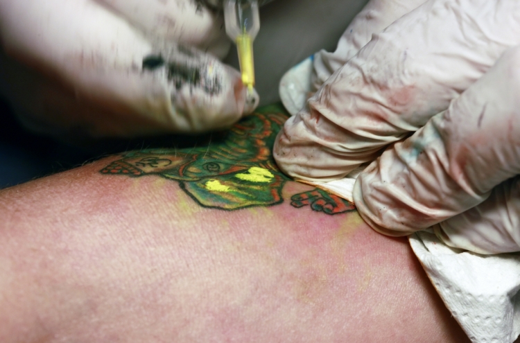 Tattooists call for legalization of nonmedical tattoos ahead of jury trial