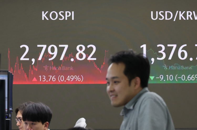 Seoul shares close higher as investors search for clues about Fed's rate policy