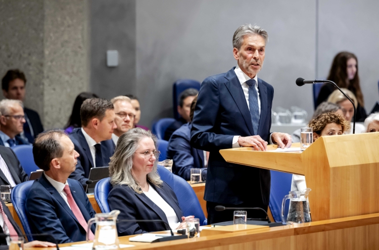 New Dutch leader pledges to cut immigration as the opposition vows to root out racists in cabinet