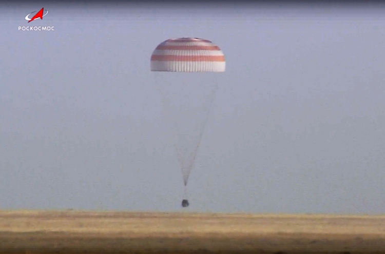 Soyuz capsule with 2 Russians and 1 American from the International Space Station returns to Earth