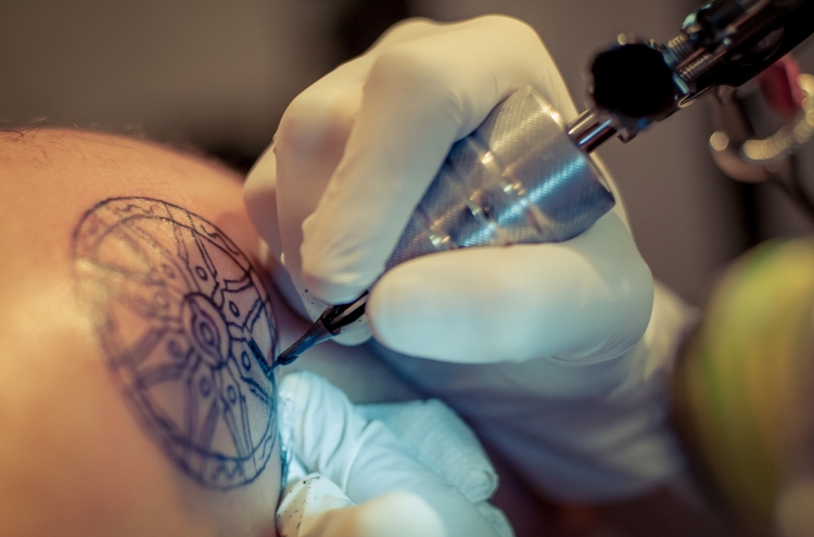 Tattoo artist calls for all body inking to be legal at audit