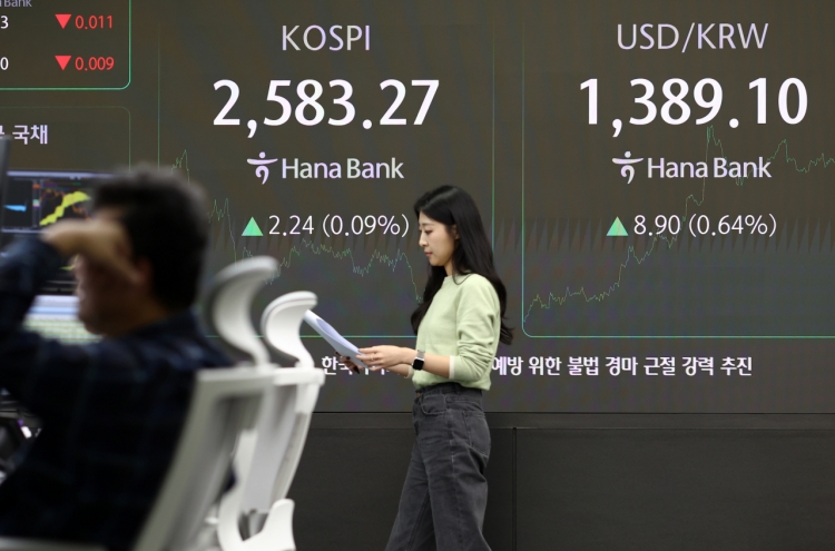 Seoul shares end tad higher; won at nearly 4-month low