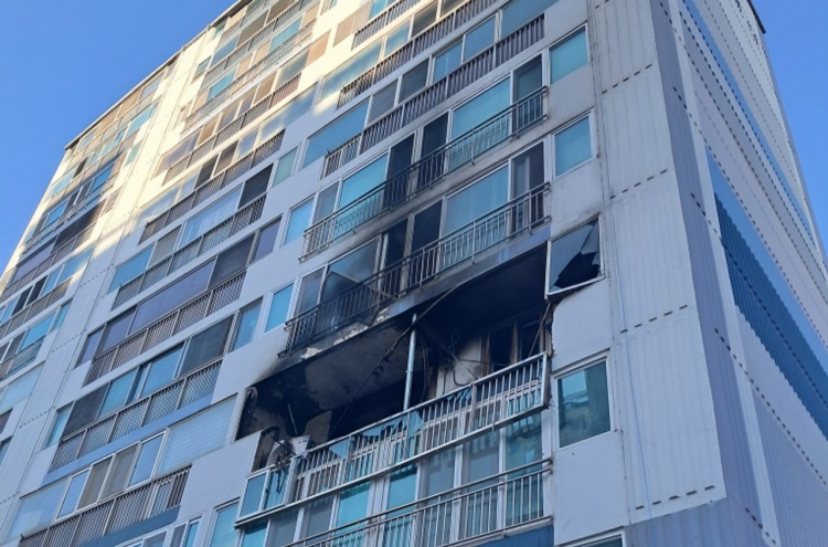 Two butane gas explosions start fires in apartments, killing one