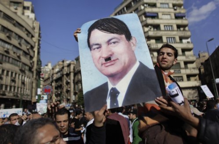 A portrait of Mubarak with moustache and hair to represent Hitler