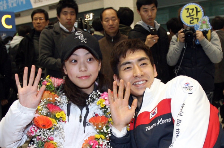 Korean athletes return home