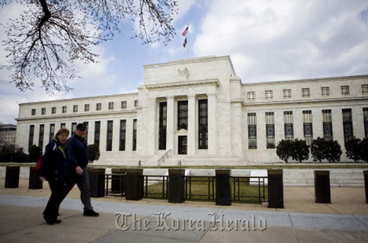 Fed officials slightly more upbeat on economy