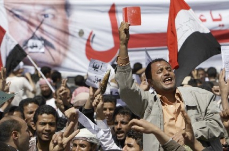 Yemeni president digs in as protests spread