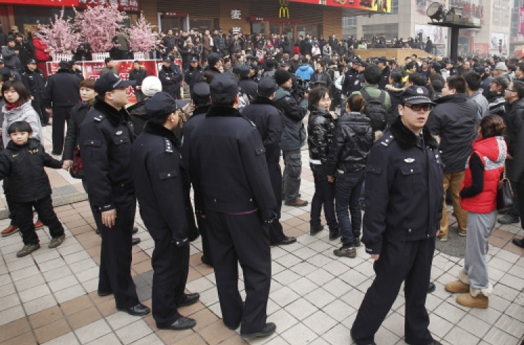 China charges subversion for protest repostings