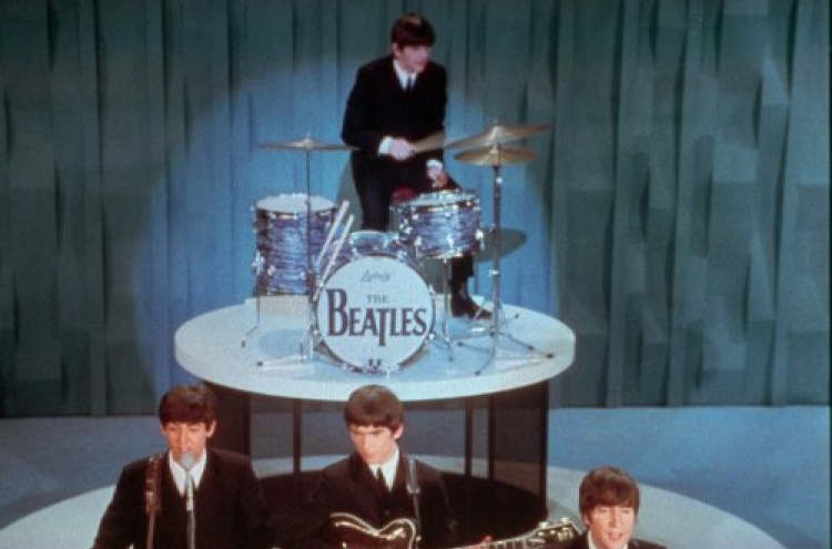 Website to pay $950,000 after selling Beatles hits
