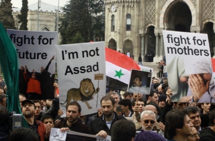 Syria lifts hated law, but protesters unimpressed