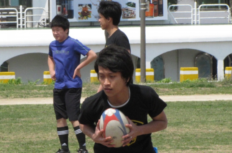 Rugby clinic puts Malaysian students in touch
