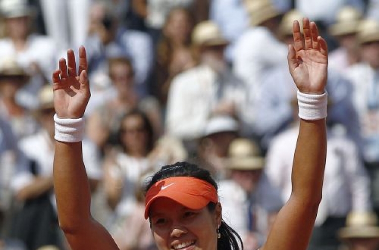 Li Na becomes first Chinese to win Grand Slam singles title