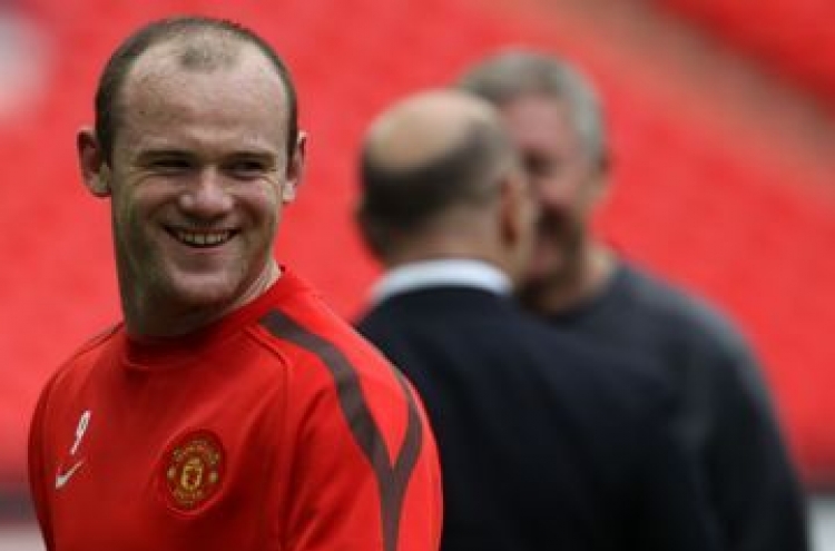 Rooney delighted with hair transplant
