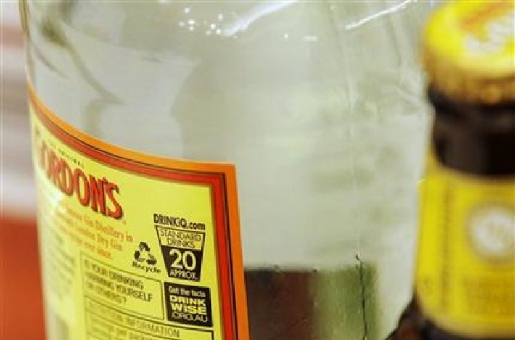 Australia puts health warnings on booze bottles
