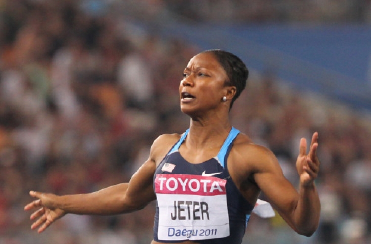 American Jeter wins world women's 100m gold