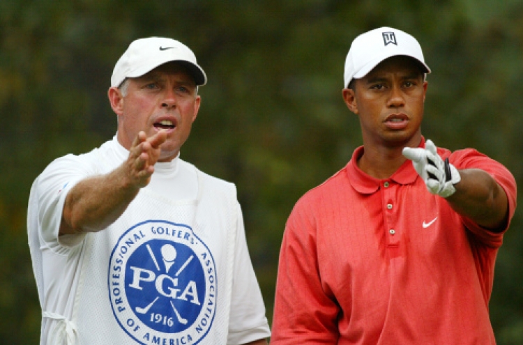 Tiger’s former caddie rips him with racial comment