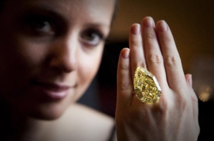 Giant yellow diamond auctioned for over $10.9M