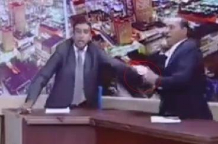 Jordanian lawmaker pulls out gun during TV debate