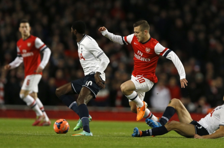 Arsenal sinks Spurs in cup, Blades fell Villa