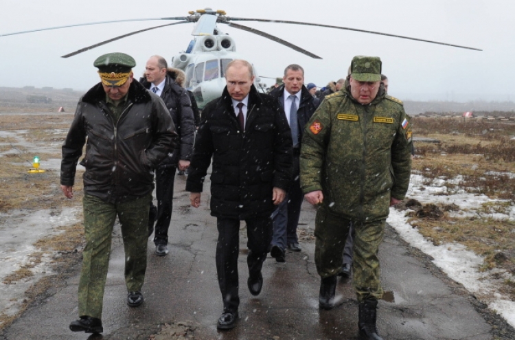 Putin ends military drills, but Crimea tension still high
