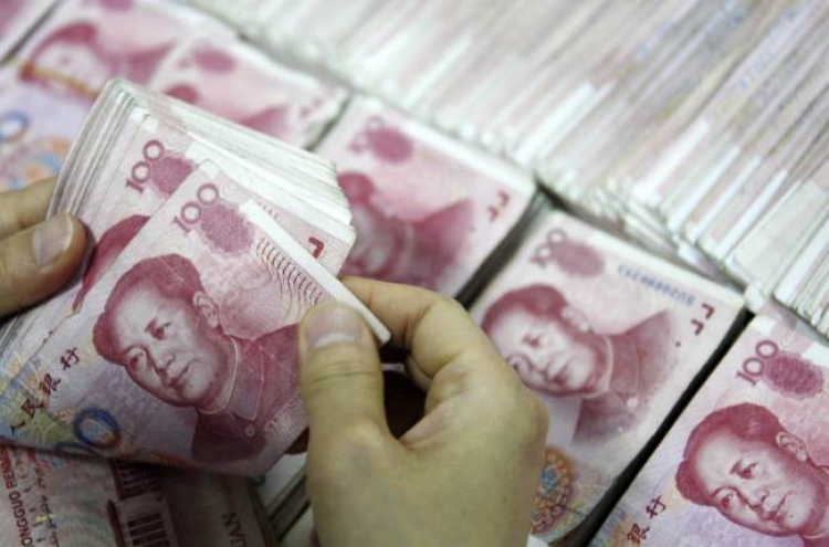 China doubles yuan trading band