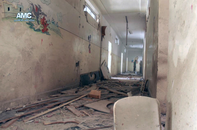 Air strike on Syrian school kills at least 19