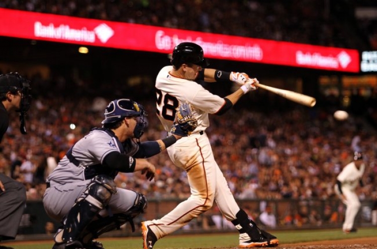 Hudson leads Giants past Padres 3-2