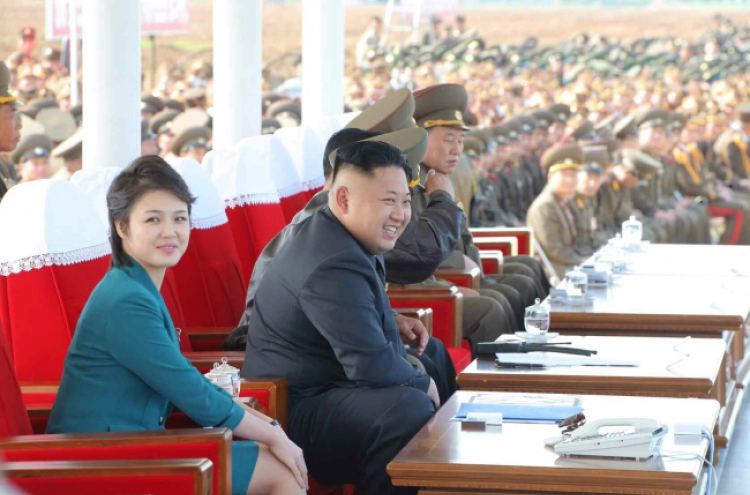 North Korean leader, wife attend air force test event