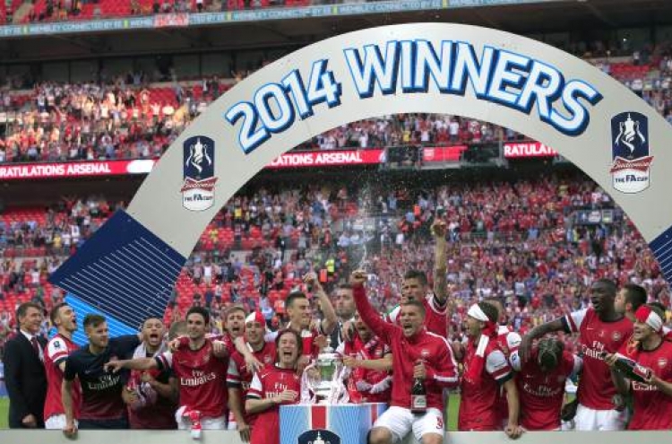 Arsenal ends 9-year title drought