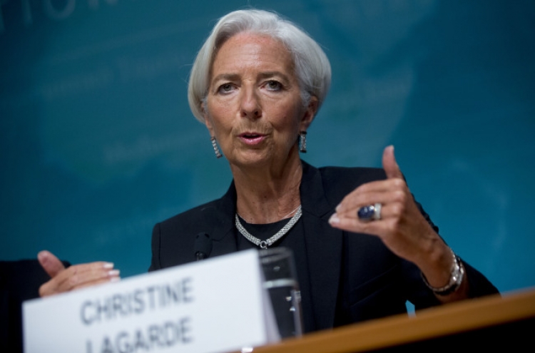 IMF cuts U.S. growth forecast, issues warning