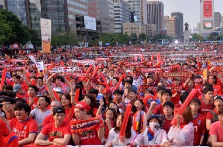 Wave of red shirts cheers on Korea