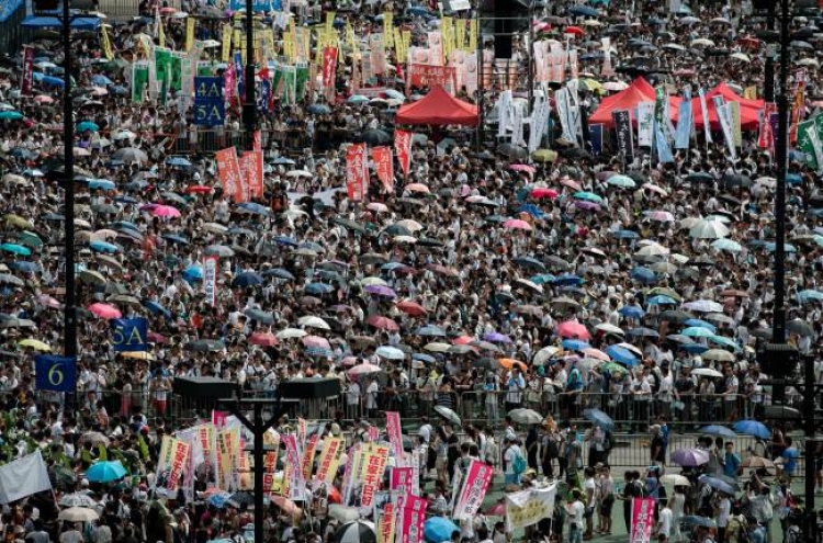 Tens of thousands march for democracy in H.K.