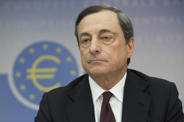 ECB holds fire on rates but on alert
