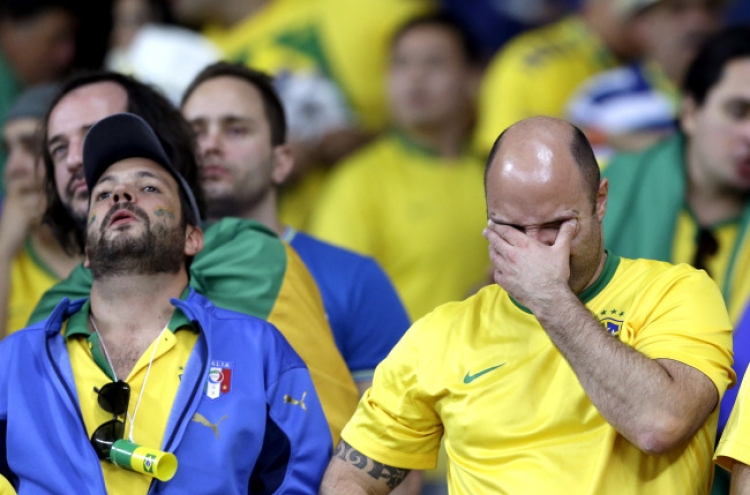 Brazilians cry and curse at humiliation