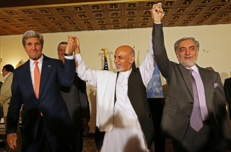 Afghan rivals clinch deal, easing crisis