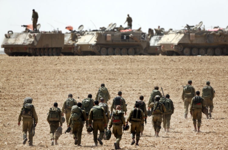 Israel troops briefly raid Gaza as offensive rages