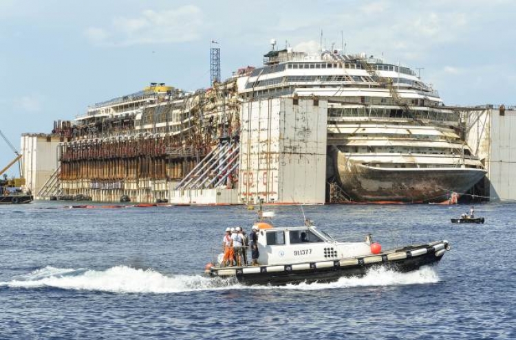 Italy’s giant cruise wreck begins final voyage